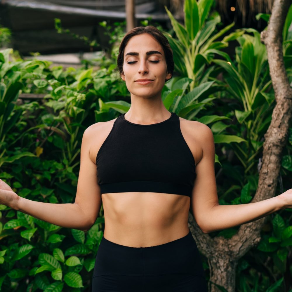 Caucasian woman enjoying pleasure and mindfulness enlightenment during balance concentration
