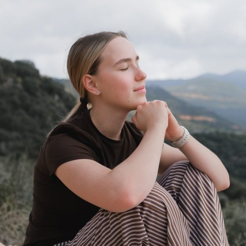 woman in the mountains, embracing slow living and mindfulness. A moment of balance, self-care,